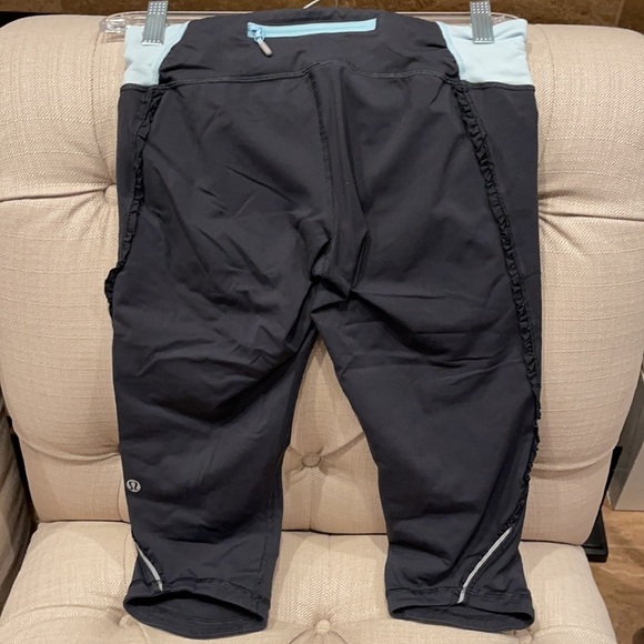 B: 𝅺Lululemon Sz 6 Run Fast and Free Crop Leggings Black Teal ruffle accent - Picture 2 of 9